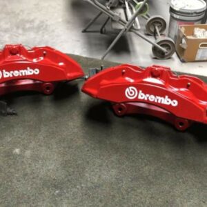 Brembo brakes calipers with brakes lines.